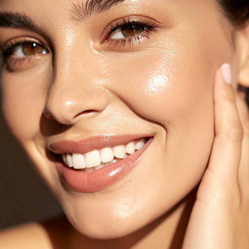 Woman with smooth, hydrated-looking skin after a chemical peel or laser treatment