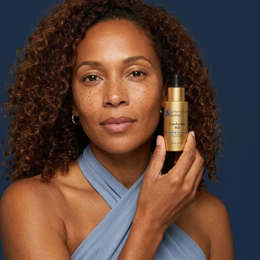 Conforma HA being held by woman in blue with curly hair