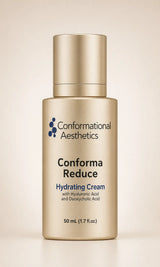 A bottle of Conformational Aesthetics Conform Reduce Hydrating Cream in a metallic gold finish, set against a soft beige background. 