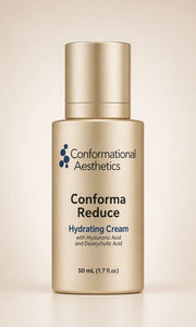 A bottle of Conformational Aesthetics Conform Reduce Hydrating Cream in a metallic gold finish, set against a soft beige background. 
