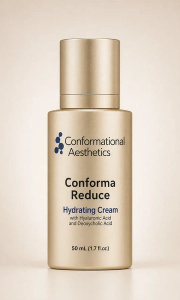 A bottle of Conformational Aesthetics Conform Reduce Hydrating Cream in a metallic gold finish, set against a soft beige background. 